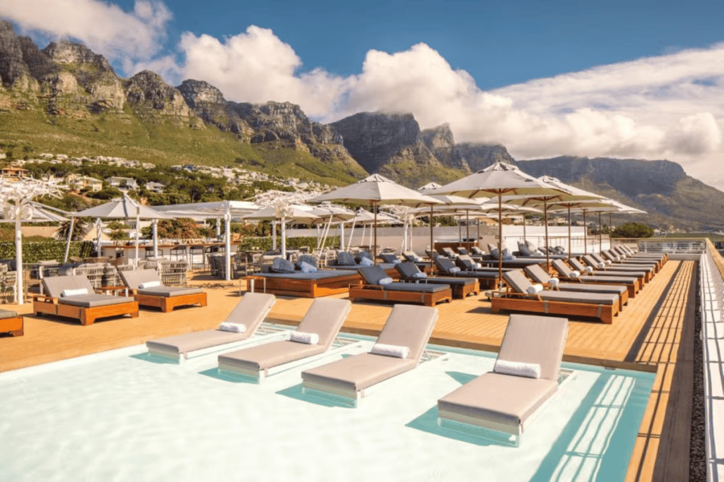Sun loungers against mountains