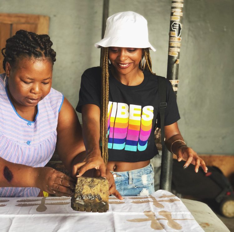 Jewels creating batik fabric in Accra