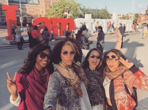 Friends in front of Amsterdam sign