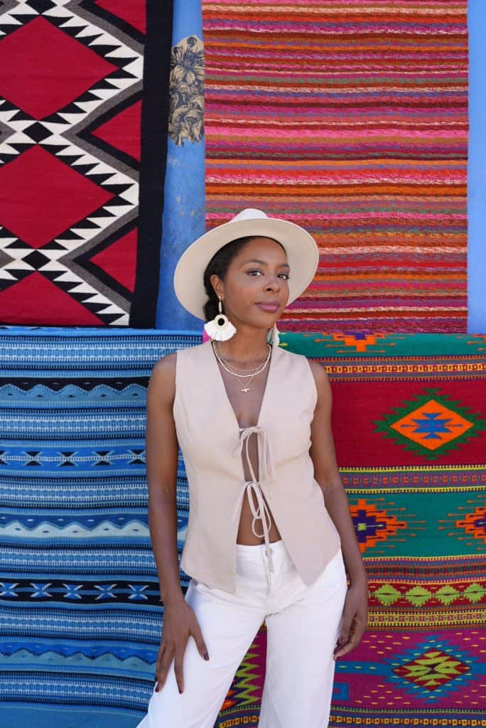 Woman standing in front of textiles