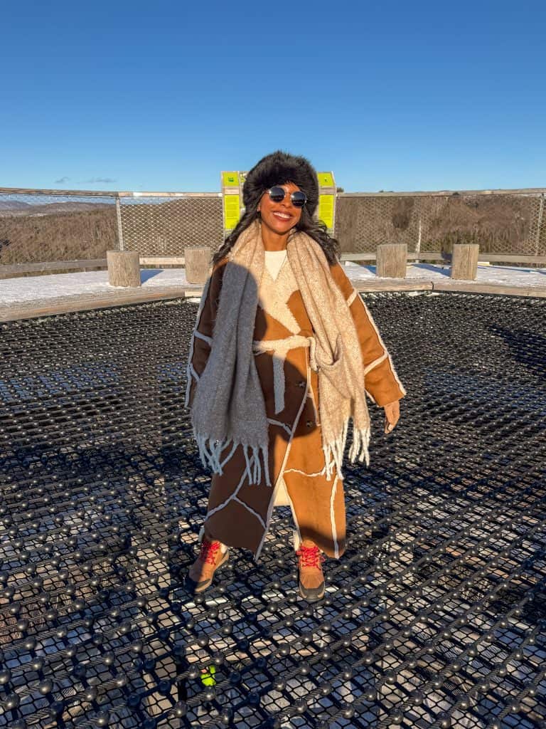 woman on top of tower at Sentier des Cimes